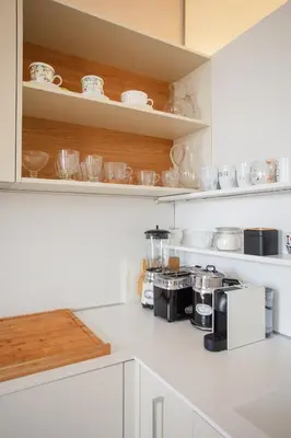 a kitchen with a counter with a coffee maker at Skyscraper Amazing Castle & City View Apartment in Ljubljana