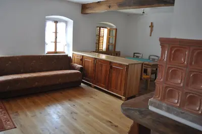 a living room with a couch and a table at Apartments Koptur in Škocjan