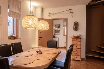 a dining room with a table and chairs at Chalet Fisherman's Cottage in Bohinj