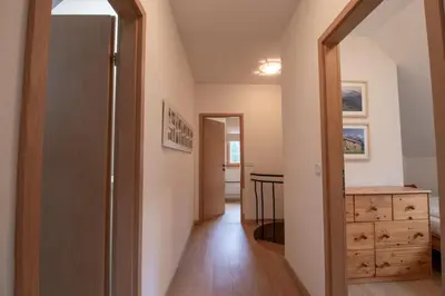 a hallway with a door leading to a bedroom at Chalet Fisherman's Cottage in Bohinj