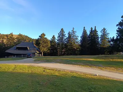 a gazebo on a golf course with a road at Studio Queen Alpine in Cerklje na Gorenjskem