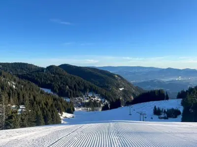 a view of a snow covered mountain with a ski slope at Weiss Sport & Relax Apartment in Rečica ob Savinji