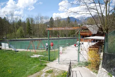 a pool of water with a sign that says swimming workshop at Apartma Mihovc in Kamnik