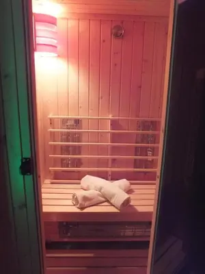 two towels sitting on a bed in a room at Apartma Mihovc in Kamnik