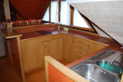 a small kitchen with a sink and a window at Apartma Mihovc in Kamnik