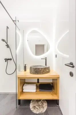 a bathroom with a sink and a mirror at Charming A&S Pohorje Apartments in Pohorje