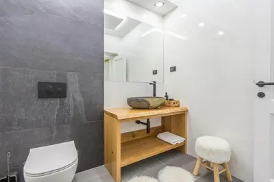 a bathroom with a toilet and a sink at Charming A&S Pohorje Apartments in Pohorje