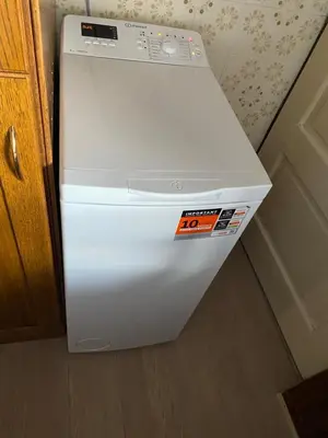 a white refrigerator with a sticker on the front of it at Granny Angela's house in Grosuplje