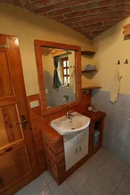 a bathroom with a sink and a mirror at Holiday home in Otocec - Kranjska (Krain) 33898 in Otočec