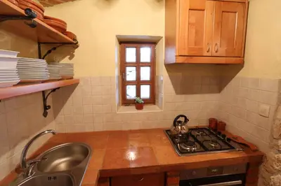 a kitchen with a sink and a stove and a window at Holiday home in Otocec - Kranjska (Krain) 33898 in Otočec