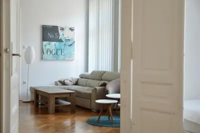 a living room with a couch and a table at Apartment Trdinova in Ljubljana