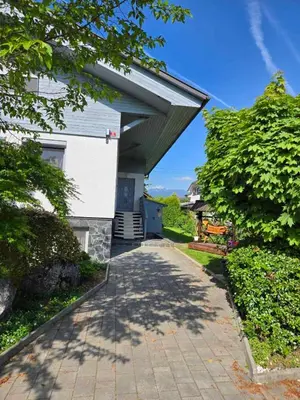a house with an overhang on a walkway at Montis Bled in Bled
