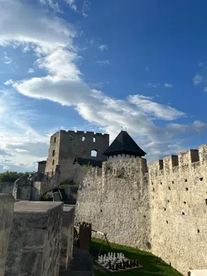 a large castle with a building in the background at Studio Belaj in Celje