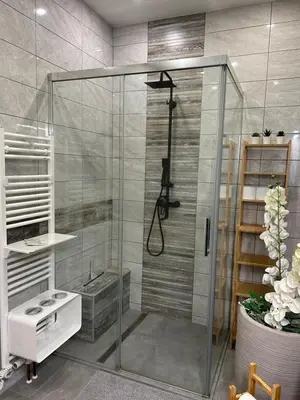 a shower with a glass door in a bathroom at Studio Belaj in Celje