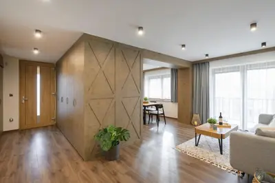 a living room with a large sliding barn door at Dovski Razgled in Dovje