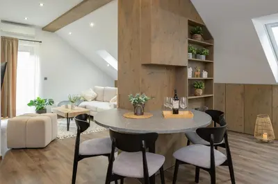 a living room with a table and chairs at Dovski Razgled in Dovje