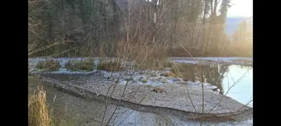 a view of a river with snow on the ground at Mala Savca in Loka pri Zidanem Mostu