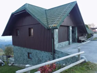 a small building with a gambrel roof on top at Apartment Zeleni dragulj Pohorje, mir & čudovita narava in Oplotnica