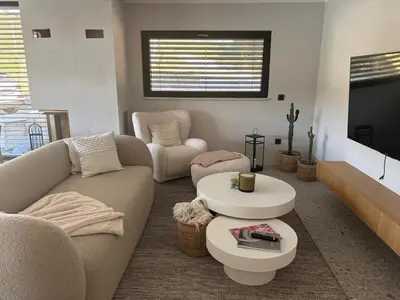 a living room with a couch and a table at Vila Solini in Kozana