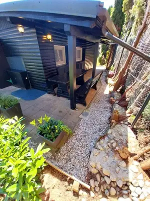 a small house with a patio and a table at La Vita House Camp Terme 3000 Moravske Toplice 2 Thermal Tickets Included Free Bikes in Moravske Toplice