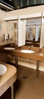 a public bathroom with three sinks and mirrors at La Vita House Camp Terme 3000 Moravske Toplice 2 Thermal Tickets Included Free Bikes in Moravske Toplice