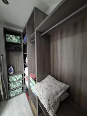 a small closet with a bed in the middle of it at Comfortable 4 room 4 full Family in Tržič