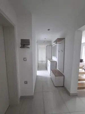a kitchen with white walls and white appliances at Comfortable 4 room 4 full Family in Tržič