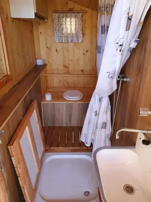 a small bathroom with a toilet and a sink at Glamping apartma Oaza miru in Preddvor