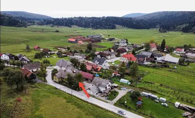 an aerial view of a small town in a field at Art & Sun in Kočevje
