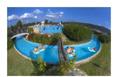 a group of people in a pool at a water park at Apartma Zala in Brežice