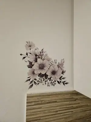 a painting of flowers on a wall in a room at Apartma Zala in Brežice