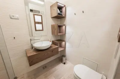 a bathroom with a sink and a toilet at Apartma BAZA in Bovec