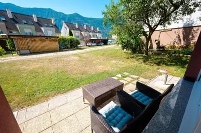 a view of a patio with a table and chairs at Apartma BAZA in Bovec