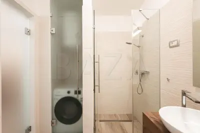 a bathroom with a shower and a toilet and a sink at Apartma BAZA in Bovec