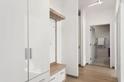 a bathroom with white walls and a walk in shower at Kristal Lux Aparments with a balcony in Rogaška Slatina