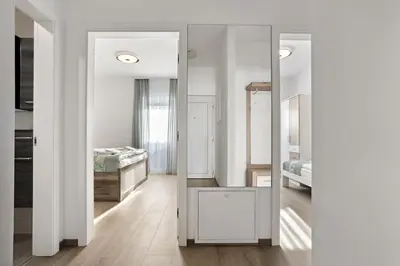 a mirror in a room with a bedroom at Kristal Lux Aparments with a balcony in Rogaška Slatina