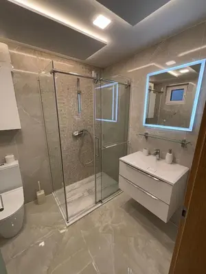 a bathroom with a shower and a toilet and a sink at SISSI Apartment Banovci in Veržej