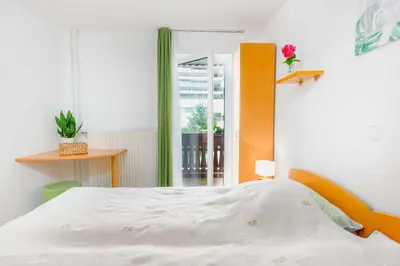a bedroom with a bed and a window at DREAMLAND BLED Apartments in Bled