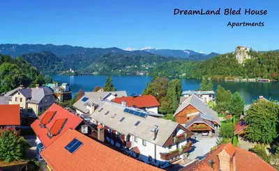 an aerial view of a town with a lake at DREAMLAND BLED Apartments in Bled