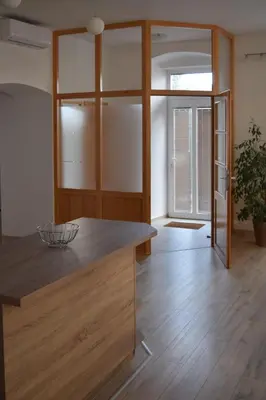 a kitchen with a wooden counter top in a room at Apartma Majerhold in Mozirje