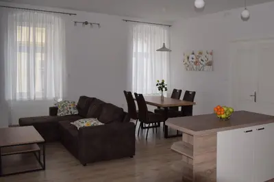 a living room with a couch and a table at Apartma Majerhold in Mozirje