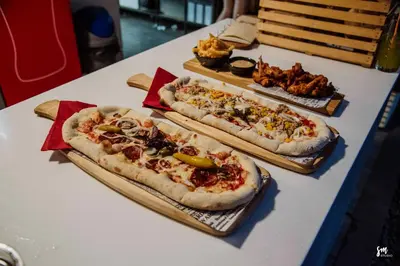 three pizzas sitting on top of a table at MAGNOLIA HOUSE by the RIVER BB in Primostek