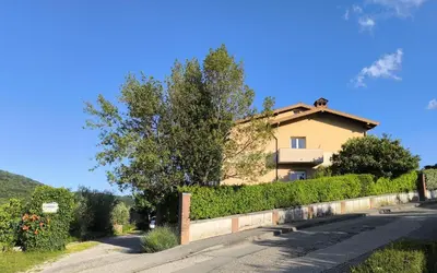 a house on the side of a road at Apartma Sunside in Branik