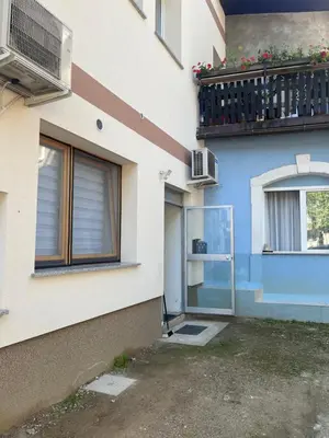 a building with a balcony and a window at Urko Apartments Ljubljana in Ljubljana