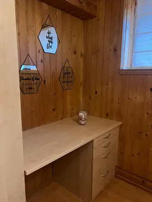 a kitchen with a desk in a wooden wall at Cosy apartment in Ljubljana in Šentvid