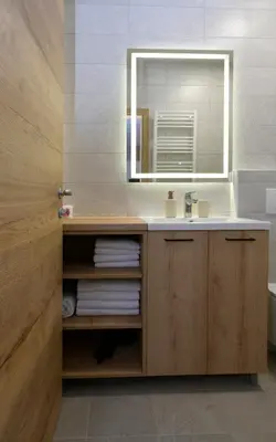 a bathroom with a sink and a mirror at Apartmaji Siliganum in Solkan