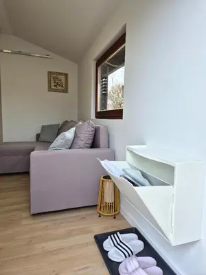 a living room with a couch and a table at Terme Banovci - Pomurski raj, tickets included in Veržej