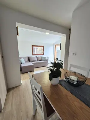 a living room with a table and a couch at Terme Banovci - Pomurski raj, tickets included in Veržej