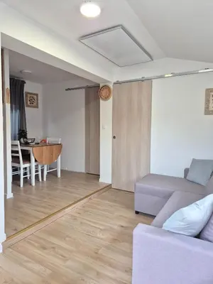 a living room with a couch and a table at Terme Banovci - Pomurski raj, tickets included in Veržej