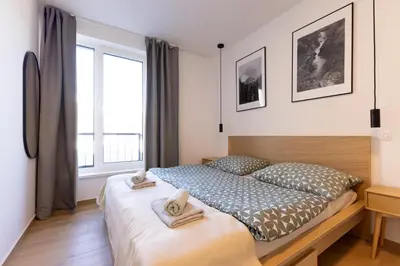 a bedroom with a bed with two towels on it at Apartment Bovec by Liza in Bovec